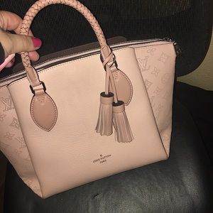 Louis Vuitton purse. Sold out on a lot of websites brand new. Lightly used